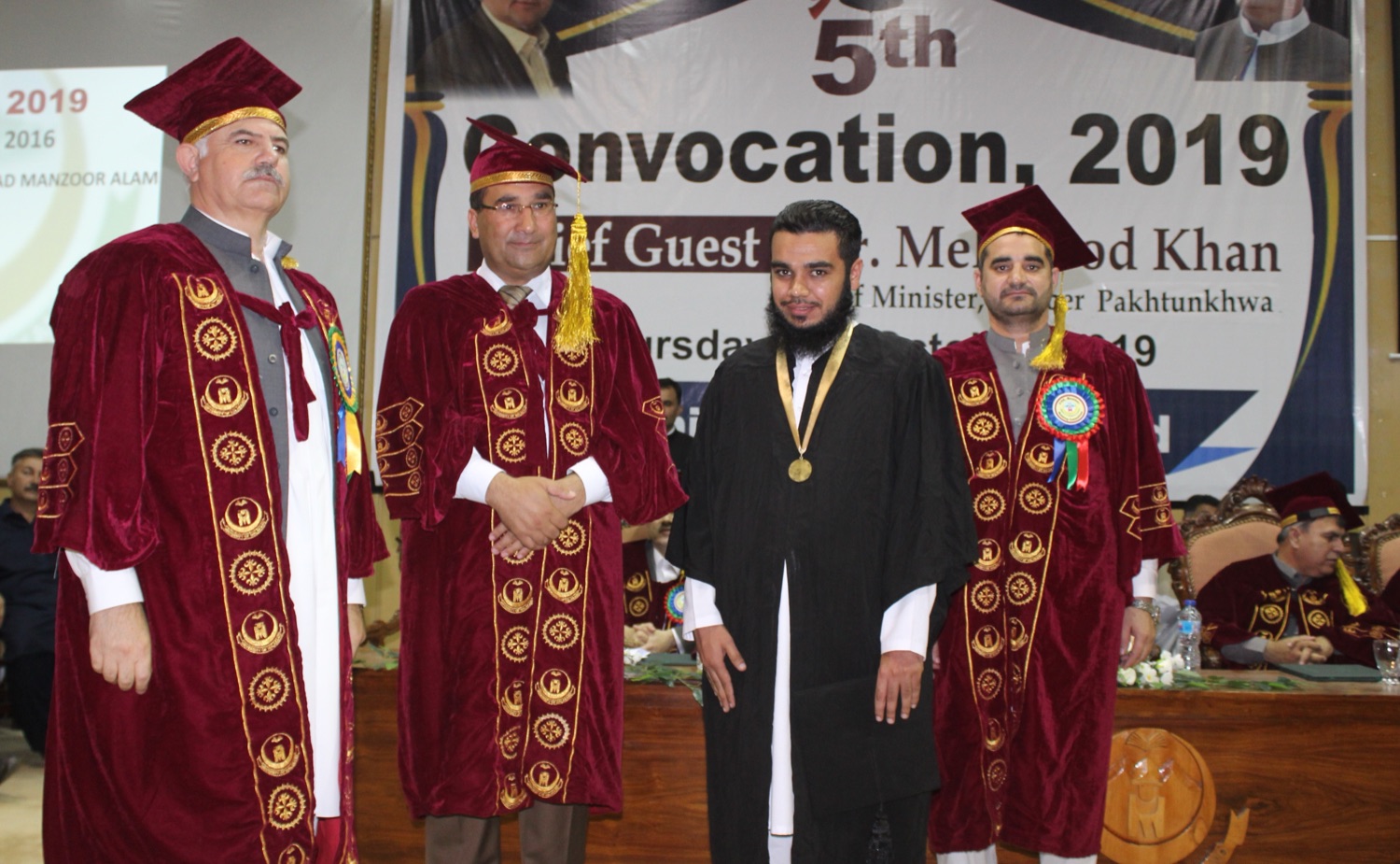 Fazal Bhai receiving the gold medal at the 5th Convocation of the University of Malakand, 2019, alongside university officials.